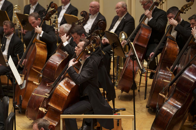 An action shot of the CSO bass section