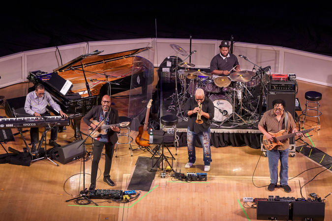 the band performs; from left, Herbie Hancock on keys, Lionel Loueke on guitar, Terence Blanchard on trumpet, Jaylen Petinaud on drums, and James Genus on bass