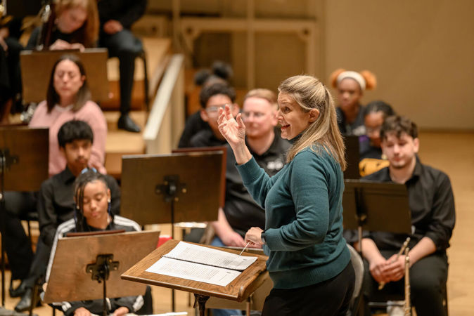 Conductor Erica Neidlinger in rehearsal.