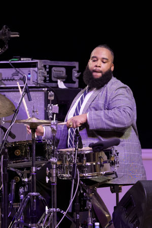 Closeup shot of drummer Nazir Ebo on stage