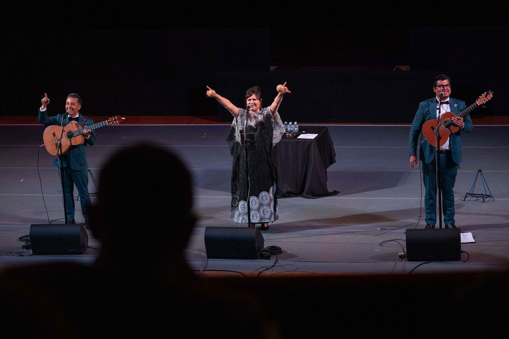the members of Los Angeles-based trio Tres Souls point to and engage the audience during their set