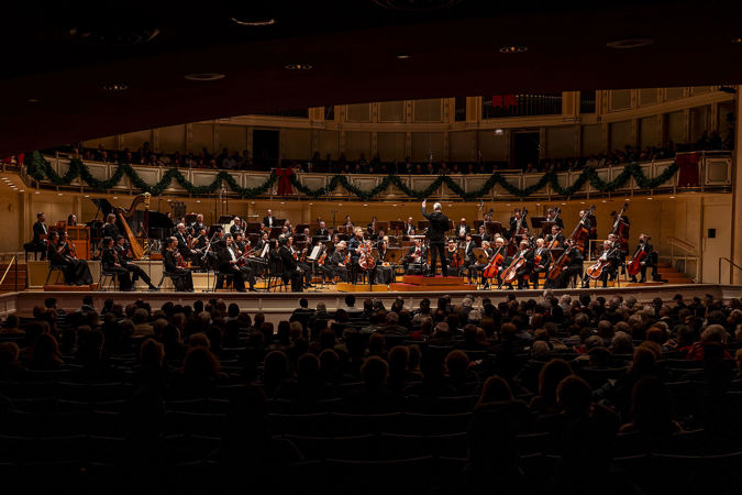 a wide shot of the Orchestra and audience during the cello concerto