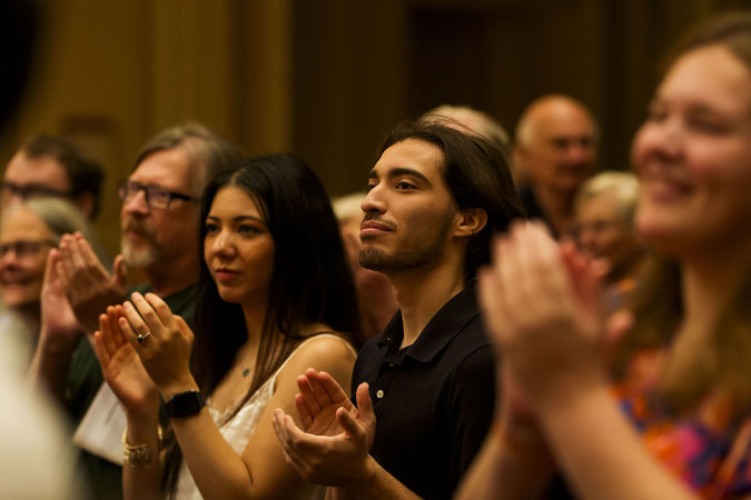 the audience gives Jennifer Gunn a standing ovation