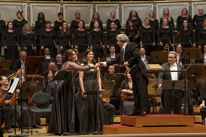 Maestro Riccardo Muti shakes the hand of soprano Elena Guseva from the podium after the performance
