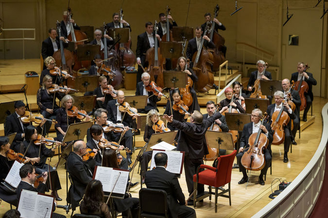 Wide shot of Mikko Franck leading the Chicago Symphony Orchestra on stage