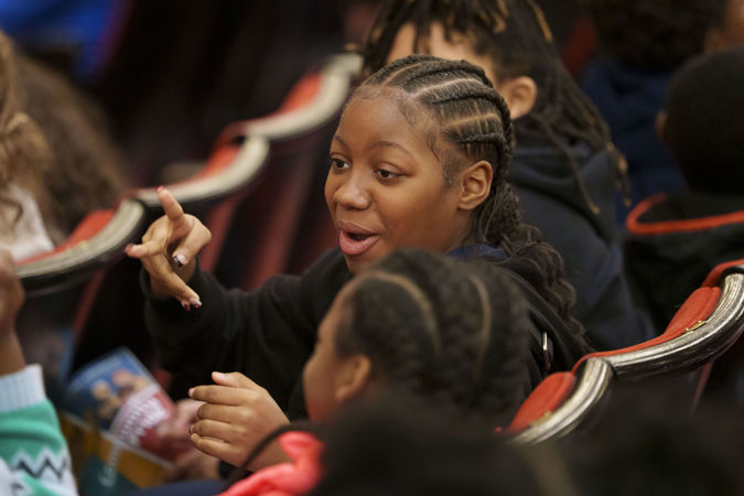 A young audience member chatting with friends on the Main Floor before the CSO for Kids concert
