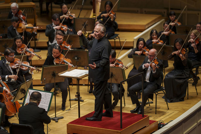 Closeup action shot of Sir Mark Elder leading the CSO