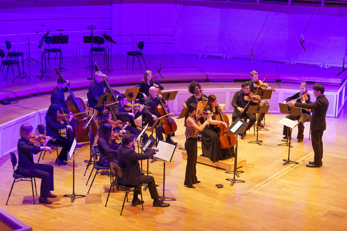 Nicholas Koo conducts a 16-member string ensemble in Jimmy López's Guardian of the Horizon