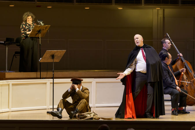 Closeup action shot of actors (the soldier, the devil and the narrator) from The Goodman performing The Soldier's Tale on stage with the CSO