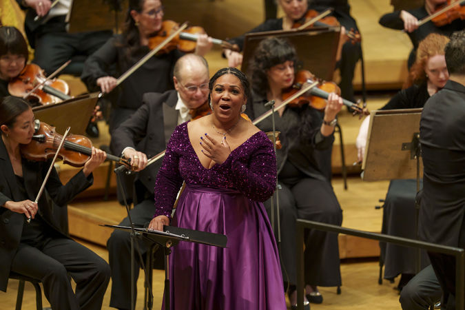 Janai Brugger raises a hand to her chest in heartfelt emotion as she sings selections by Florence Price