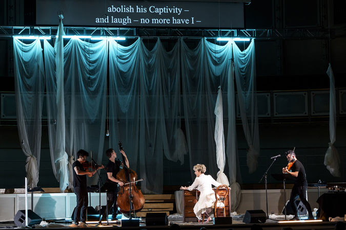 Joyce DiDonato and Time For Three perform Emily - No Prisoner Be, surrounded by white curtains and eerie blue light