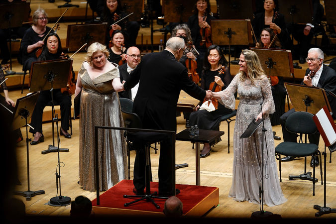 conductor shaking hands of soloists