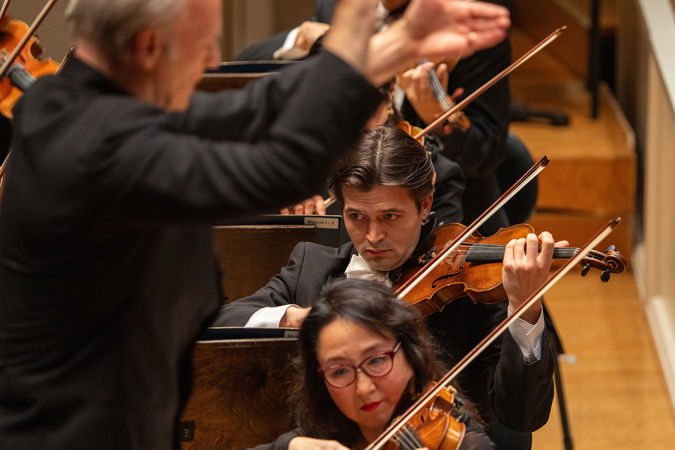 Closeup shot of CSO violin Matous Michal on stage