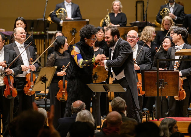Julia Bullock and Petr Popelka embrace on stage after the performance