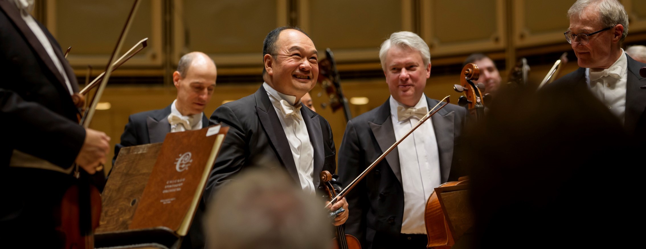 CSO concertmaster Robert Chen smiles on stage