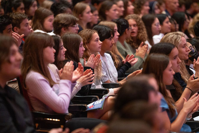 students clapping