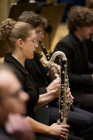 Closeup of a Civic musician warming up