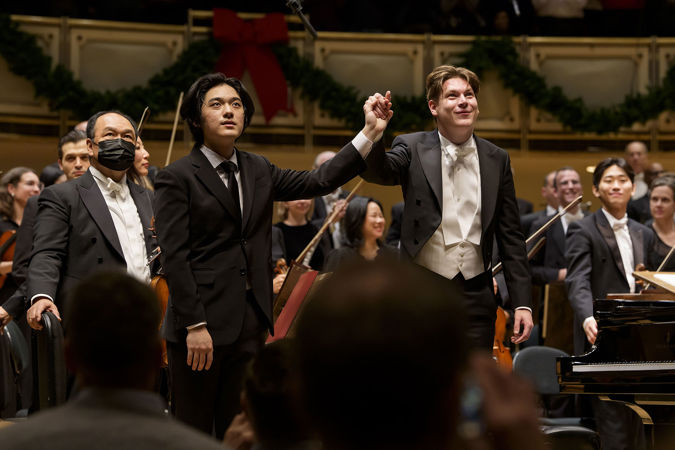 pianist Yunchan Lim and conductor Klaus Mäkelä take a bow hand-in-hand