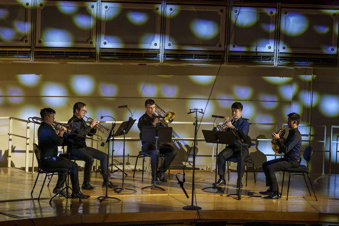 a brass quintet performs Adam Schoenberg's Reflecting Light, a poignant meditation on loss